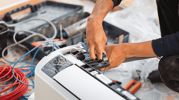 ALJ Heating & Cooling technician performing AC installation in Albany, NY