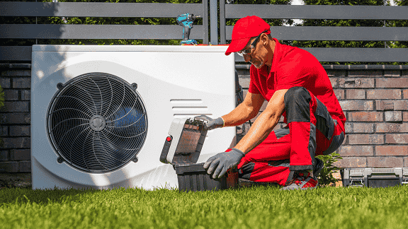 Licensed HVAC professional servicing a residential furnace in Albany, NY